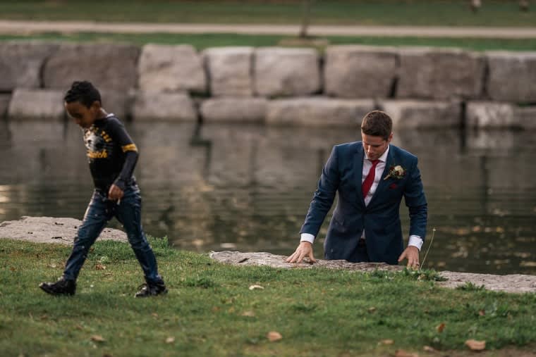 Image: Clayton Cook exits the water after rescuing a boy from drowning at Victoria Park in Kitchener, Ontario, on September 22, 2017