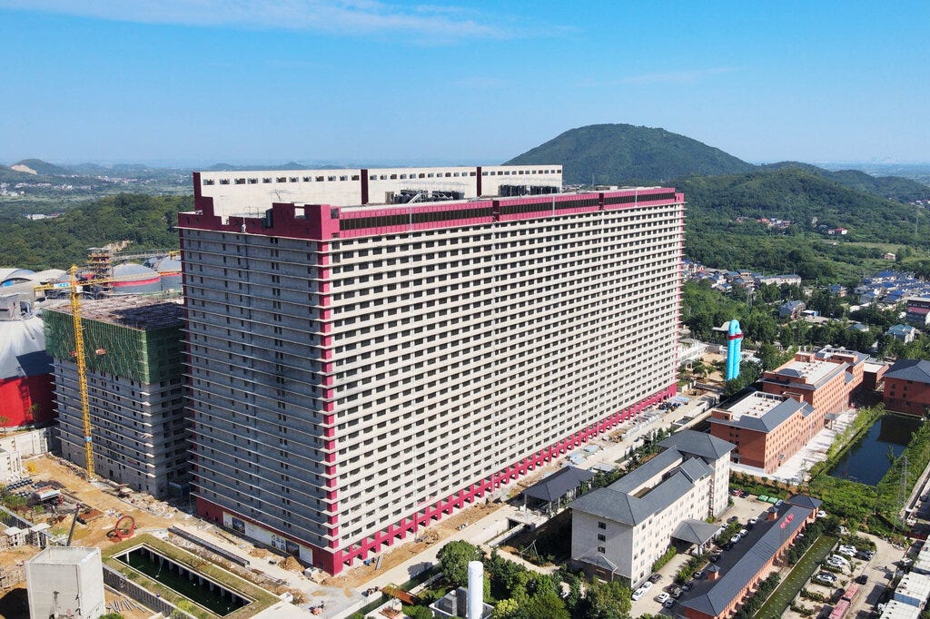 China's Bid to Improve Food Production? Giant Towers of Pigs. - The New  York Times